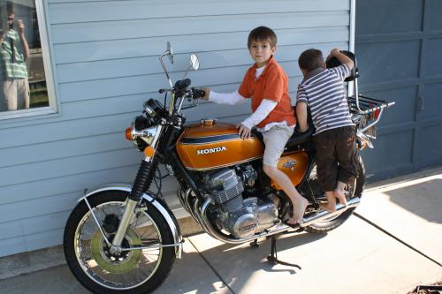 The boys love dad's motorcycle!